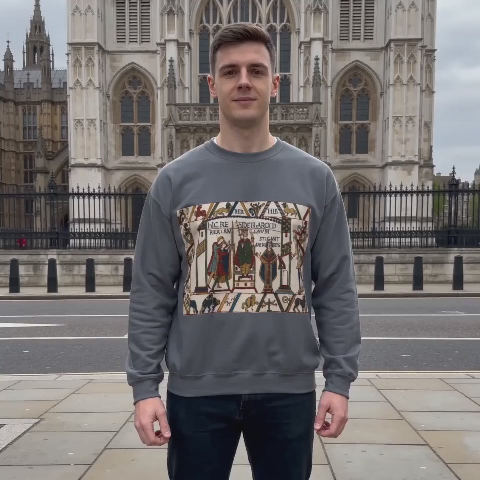 Product video showcasing the charcoal King Harold II Coronation Sweatshirt, featuring a design inspired by Charles Stothard’s rendering of the Bayeux Tapestry.