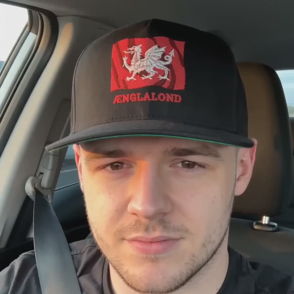Ænglalond — White Dragon Wavy Flag Snapback Cap heritage accessory, model wearing Black colourway