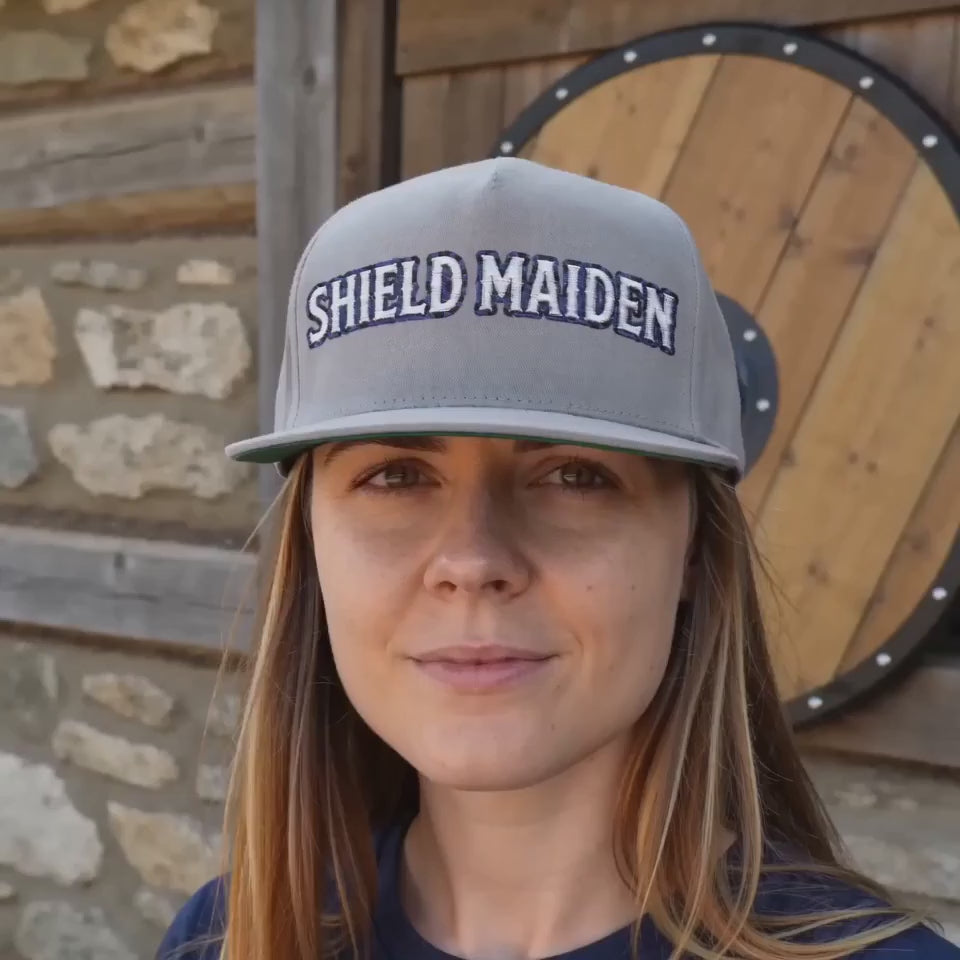 Shield Maiden Embroidered Flat Bill Cap — Norse heritage snapback, model wearing grey colourway